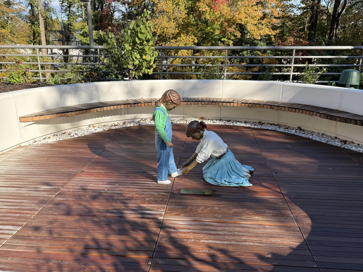 Restored terrace at Freddie Mac Headquarters 1 with new hardwood decking, curved bench and sculpture