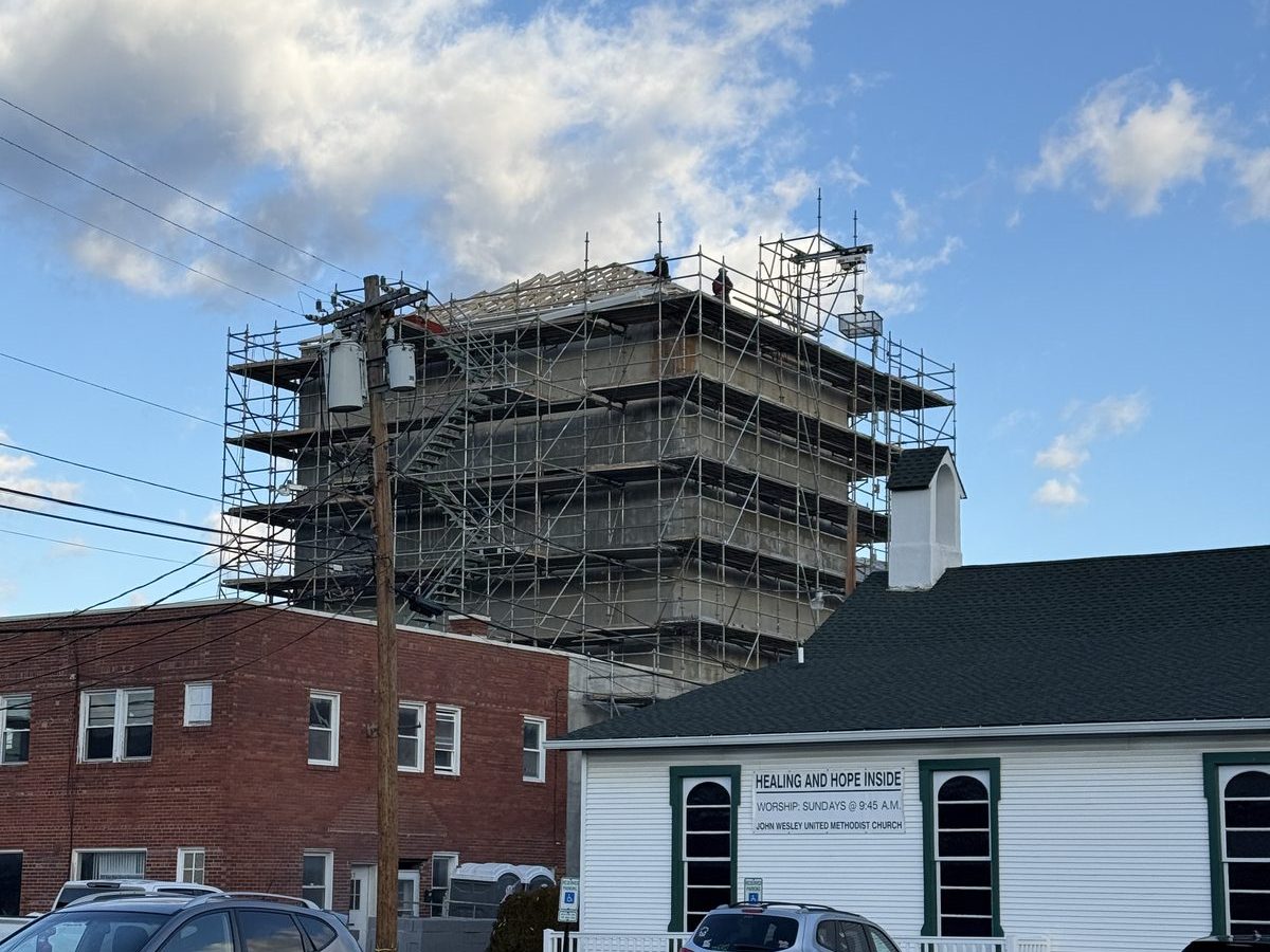 Scaffolded fly tower of the historic Murphy Building theater in Front Royal during roof reconstruction and facade restoration