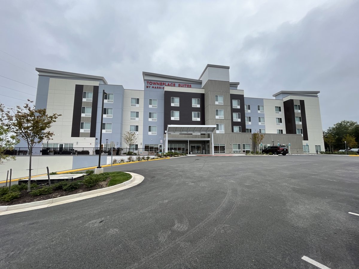 Four story light frame TownePlace Suites hotel in Woodbridge with basement retail space