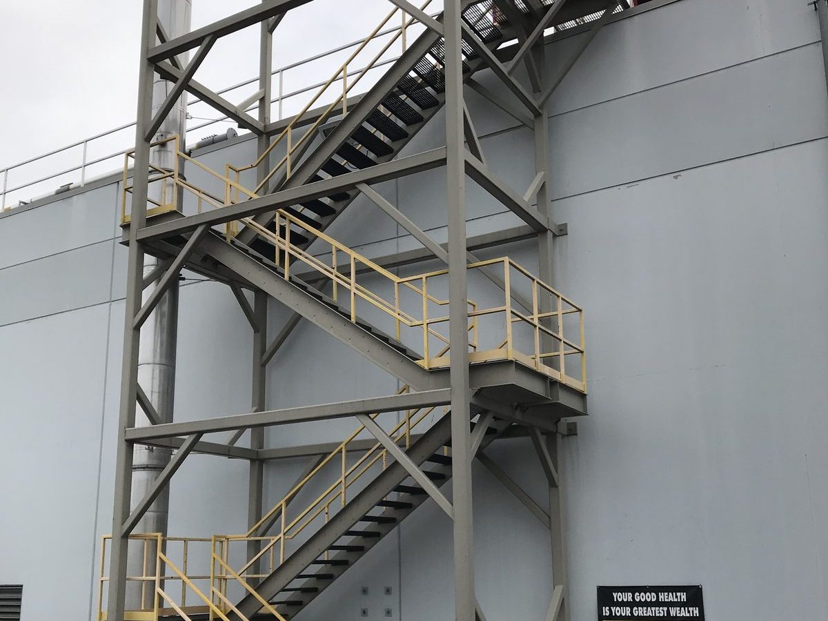 New exterior steel stair tower giving access to operations at several levels including the roof at Trex Building 6